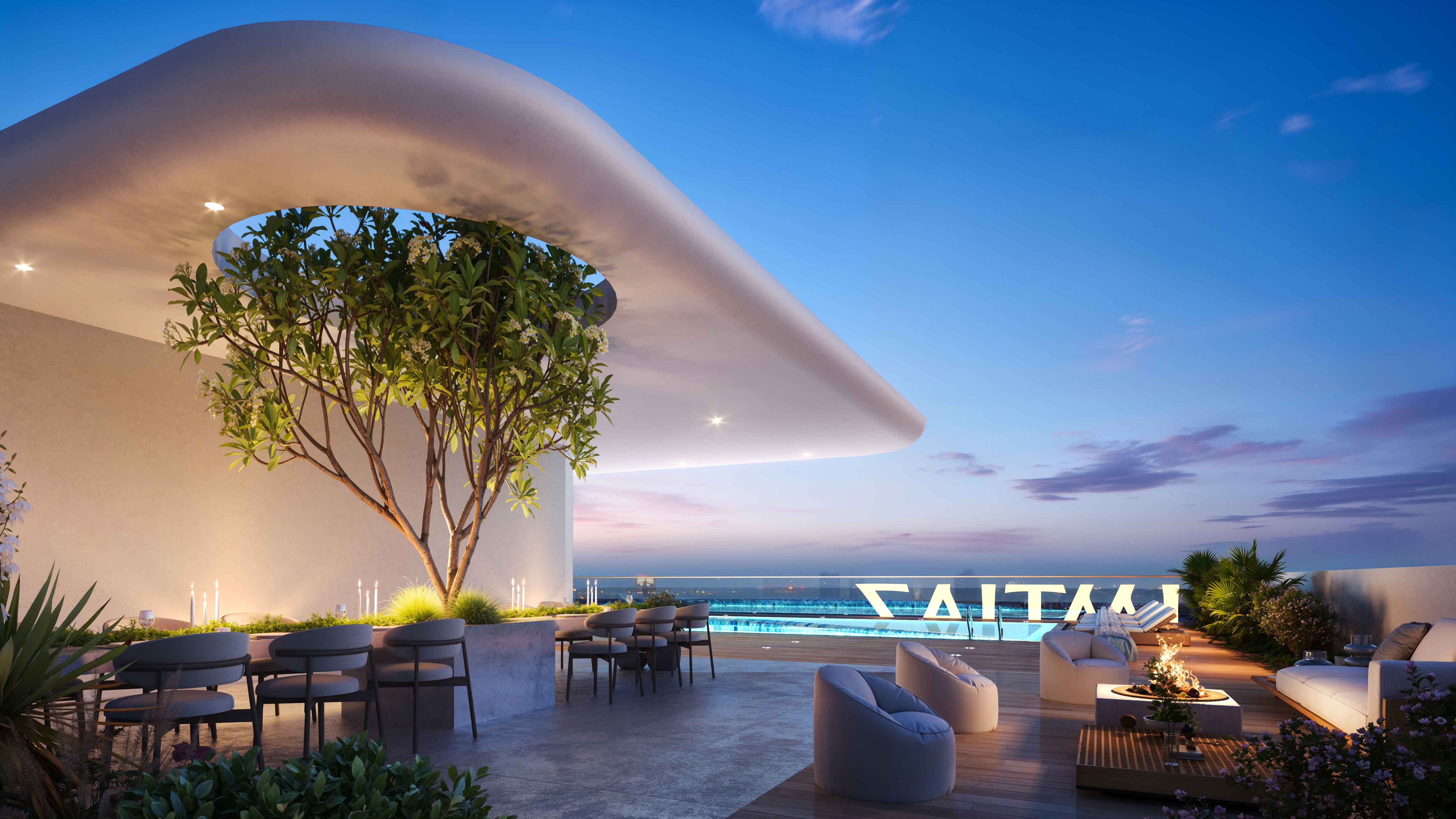 Pearl House 4 By Imtiaz A modern rooftop terrace with circular seating, a tree, a fire pit, and a pool against a twilight sky.